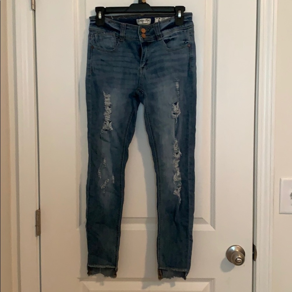 Distressed blue jeans